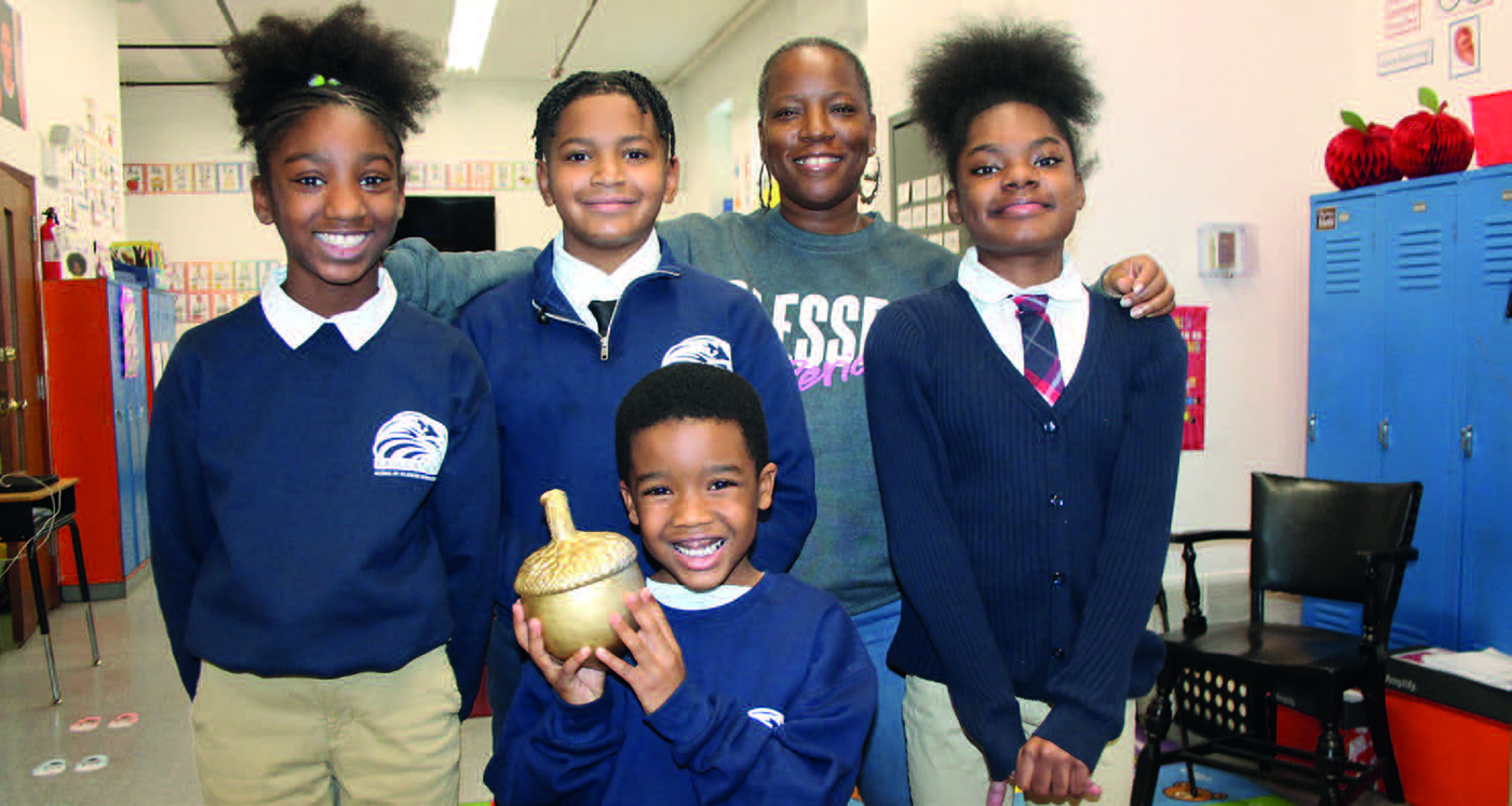 school-kids-holding-acorn-in-uniform